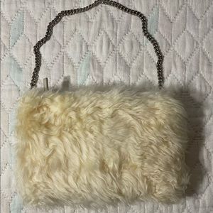 Ugg Pom Pom fur fluffy curly sheepskin clutch and hand warmer bag.